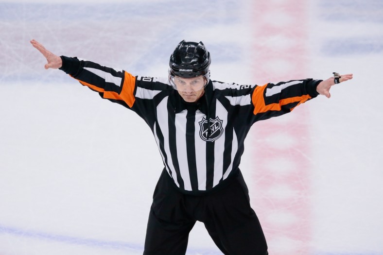 Apr 22, 2018; Denver, CO, USA; Referee Tim Peel (20) waves off a Colorado Avalanche goal in the second period against the Nashville Predators in game six of the first round of the 2018 Stanley Cup Playoffs at the Pepsi Center. Mandatory Credit: Isaiah J. Downing-USA TODAY Sports