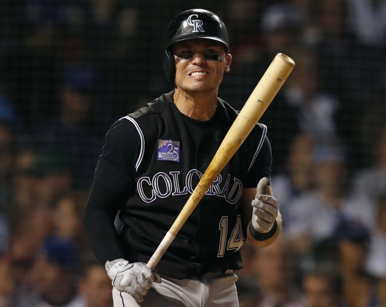 May 1, 2018; Chicago, IL, USA; Colorado Rockies catcher Tony Wolters (14) reacts after a strike against the Chicago Cubs during the fifth inning at Wrigley Field. Mandatory Credit: Jim Young-USA TODAY Sports