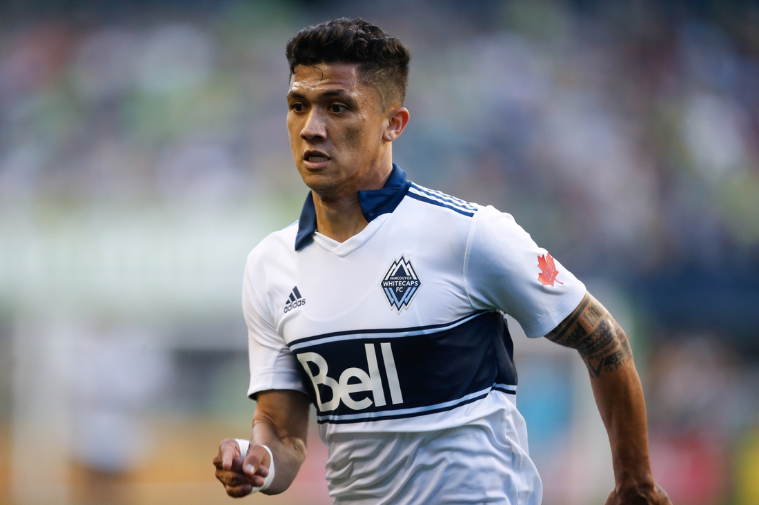 Jun 29, 2019; Seattle, WA, USA; Vancouver Whitecaps forward Fredy Montero (12) runs against the Seattle Sounders during the first half at CenturyLink Field. Mandatory Credit: Jennifer Buchanan-USA TODAY Sports