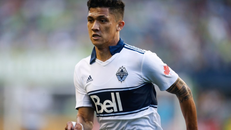 Jun 29, 2019; Seattle, WA, USA; Vancouver Whitecaps forward Fredy Montero (12) runs against the Seattle Sounders during the first half at CenturyLink Field. Mandatory Credit: Jennifer Buchanan-USA TODAY Sports