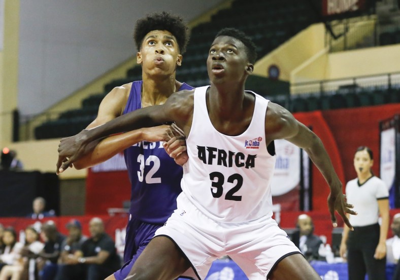 Aug 11, 2019; Orlando, FL, USA; West guard Quinton Webb (left) and Africa guard Badara Aliou Diakite battle for a rebound during the first half of the boys Jr. NBA Global Championship Game at ESPN Wide World of Sports Complex. Mandatory Credit: Reinhold Matay-USA TODAY Sports