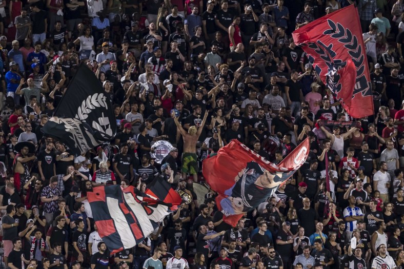 Aug 21, 2019; Washington, D.C., USA; D.C. United fans celebrate against the New York Red Bulls during the first half at Audi Field. Mandatory Credit: Scott Taetsch-USA TODAY Sports