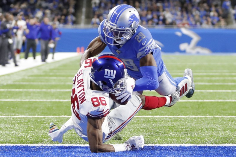 Oct 27, 2019; Detroit, MI, USA; New York Giants wide receiver Darius Slayton (86) makes a touchdown catch against Detroit Lions cornerback Rashaan Melvin (29) during the second quarter at Ford Field. Mandatory Credit: Raj Mehta-USA TODAY Sports