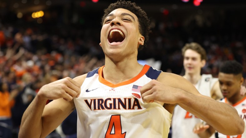 Feb 29, 2020; Charlottesville, Virginia, USA; Virginia Cavaliers forward Justin McKoy (4) celebrates while leaving the court after the Cavaliers  game against the Duke Blue Devils at John Paul Jones Arena. Mandatory Credit: Geoff Burke-USA TODAY Sports