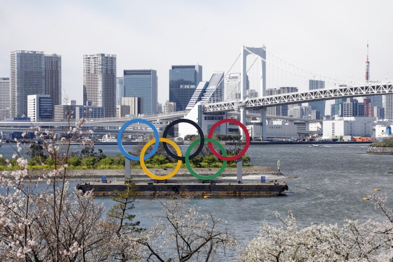 Mar 24, 2020; Tokyo, Japan; Olympic rings monument at Rainbow Bridge, Odaiba, Tokyo. On Monday the IOC announced that the Tokyo 2020 Summer Olympics Games would be postponed due to the COVID-19 coronavirus pandemic. Mandatory Credit: Yukihito Taguchi-USA TODAY Sports