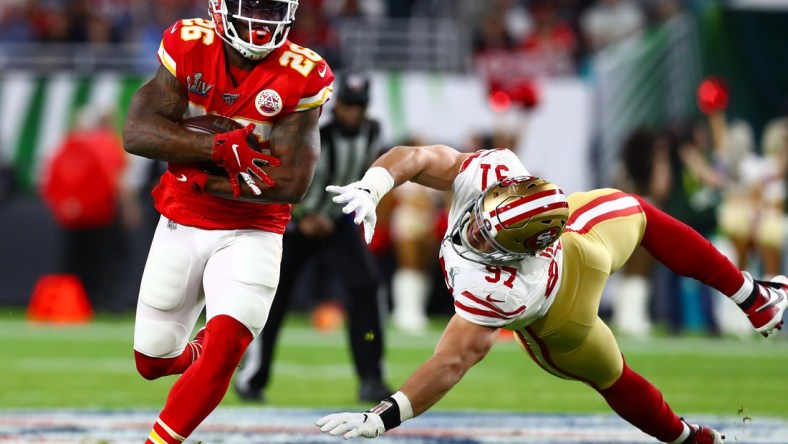 Feb 2, 2020; Miami Gardens, Florida, USA; Kansas City Chiefs running back Damien Williams (26) runs with the ball in the fourth quarter against San Francisco 49ers defensive end Nick Bosa (97) in Super Bowl LIV at Hard Rock Stadium. Mandatory Credit: Matthew Emmons-USA TODAY Sports