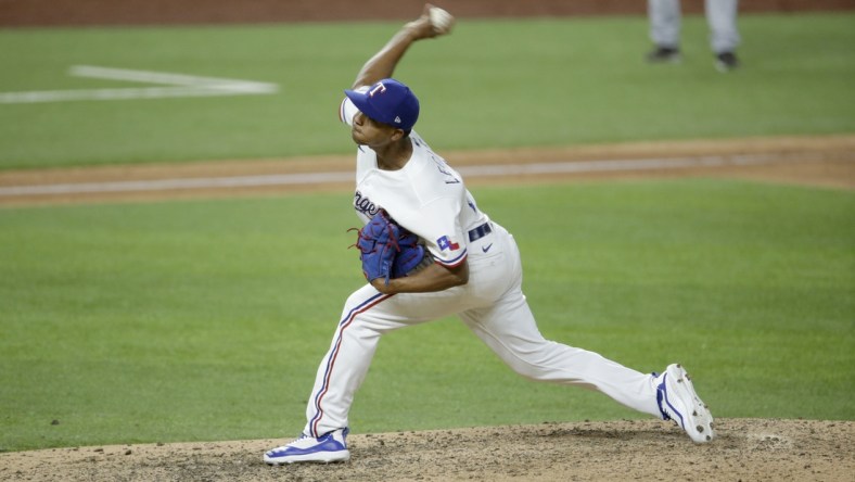 Jul 24, 2020; Arlington, Texas, USA; Texas Rangers relief pitcher Jose Leclerc (25) throws a pitch in the ninth inning against the Colorado Rockies at Globe Life Field. Mandatory Credit: Tim Heitman-USA TODAY Sports