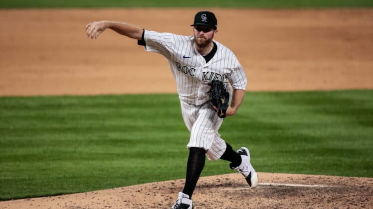 Jul 31, 2020; Denver, Colorado, USA; Colorado Rockies relief pitcher Wade Davis (71) pitches in the ninth inning against the San Diego Padres at Coors Field. Mandatory Credit: Isaiah J. Downing-USA TODAY Sports