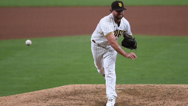 Aug 7, 2020; San Diego, California, USA; San Diego Padres relief pitcher Kirby Yates (39) pitches during the ninth inning against the Arizona Diamondbacks at Petco Park. Mandatory Credit: Orlando Ramirez-USA TODAY Sports