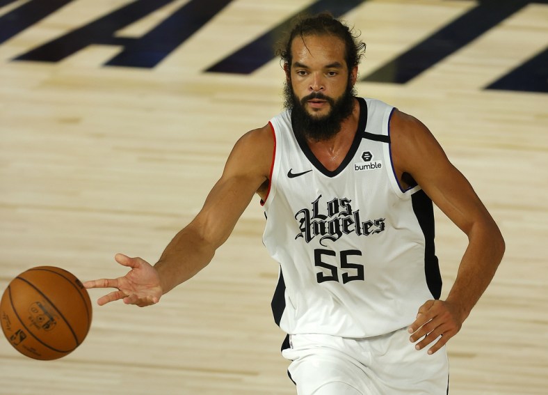 Aug 14, 2020; Lake Buena Vista, Florida, USA; Joakim Noah #55 of the LA Clippers dribbles the ball against the Oklahoma City Thunder during overtime at The Field House at ESPN Wide World of Sports Complex. Mandatory Credit: Mike Ehrmann/Pool Photo-USA TODAY Sports