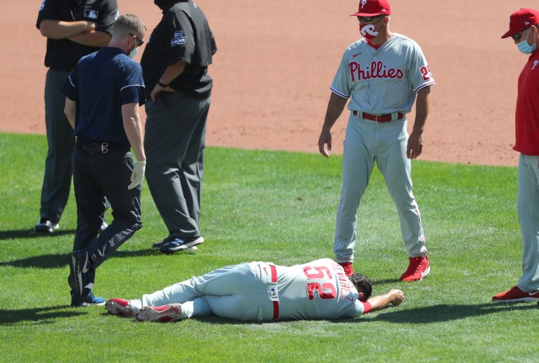 Aug 20, 2020; Buffalo, New York, USA;  Philadelphia Phillies relief pitcher Jose Alvarez (52) lays on the field after getting hit by a ball from a batter during the sixth inning against the Toronto Blue Jays at Sahlen Field. Mandatory Credit: Timothy T. Ludwig-USA TODAY Sports