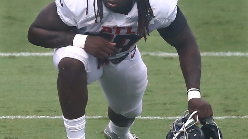 Aug 22, 2020; Flowery Branch, Georgia, USA; Atlanta Falcons defensive end Takk McKinley loosens up during training camp at the Falcons training facility. Mandatory Credit: Curtis Compton/Pool Photo-USA TODAY Sports