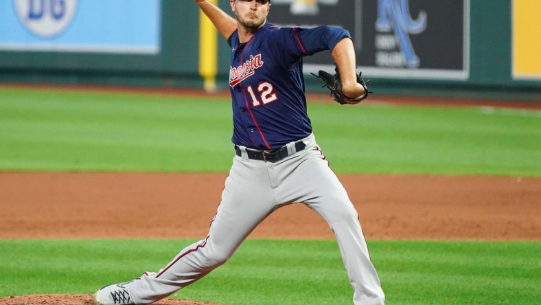 Aug 21, 2020; Kansas City, Missouri, USA; Minnesota Twins starting pitcher Jake Odorizzi (12) pitches against the Kansas City Royals at Kauffman Stadium. Mandatory Credit: Jay Biggerstaff-USA TODAY Sports