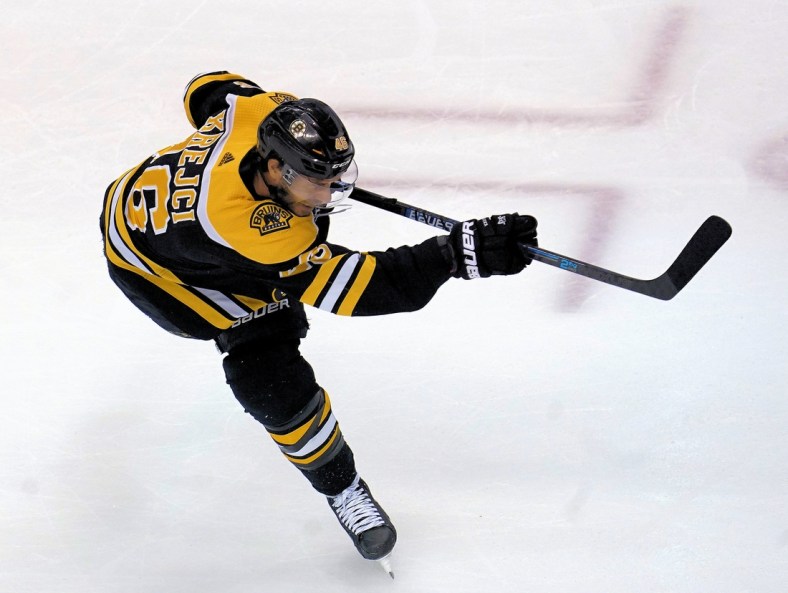 Aug 29, 2020; Toronto, Ontario, CAN; Boston Bruins forward David Krejci (46) shoots the puck during warm up before game four of the second round of the 2020 Stanley Cup Playoffs against the Tampa Bay Lightning at Scotiabank Arena. Mandatory Credit: John E. Sokolowski-USA TODAY Sports