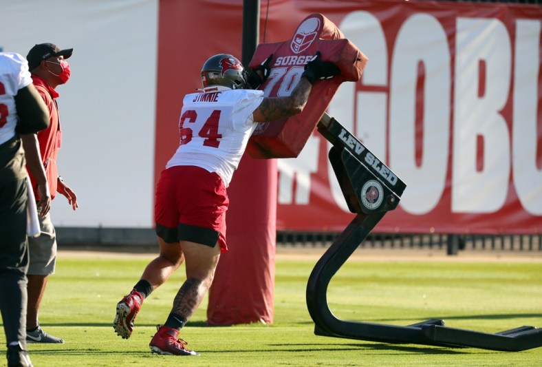 Sep 2, 2020; Tampa, Florida, USA;  Tampa Bay Buccaneers guard Aaron Stinnie (64) works out at AdventHealth Training Center. Mandatory Credit: Kim Klement-USA TODAY Sports