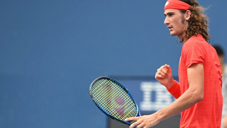 Sep 2, 2020; Flushing Meadows, New York, USA; Lloyd
Harris of South Africa reacts after winning a point against David Goffin of Belgium (not pictured) on day three of the 2020 U.S. Open tennis tournament at USTA Billie Jean King National Tennis Center. Mandatory Credit: Danielle Parhizkaran-USA TODAY Sports