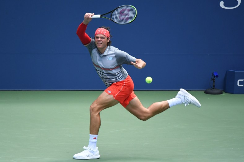 Sep 3, 2020; Flushing Meadows, New York, USA; Milos Raonic of Canada hits a forehand against Vasek Pospisil of Canada (not pictured) on day four of the 2020 U.S. Open tennis tournament at USTA Billie Jean King National Tennis Center. Mandatory Credit: Danielle Parhizkaran-USA TODAY Sports