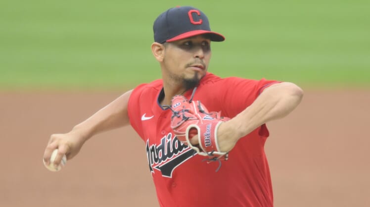 Sep 9, 2020; Cleveland, Ohio, USA; Cleveland Indians starting pitcher Carlos Carrasco (59) delivers in the first inning against the Kansas City Royals at Progressive Field. Mandatory Credit: David Richard-USA TODAY Sports