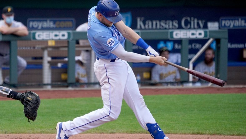 Sep 13, 2020; Kansas City, Missouri, USA; Kansas City Royals first baseman Hunter Dozier (17) connects for a solo home run in the sixth inning against the Pittsburgh Pirates at Kauffman Stadium. Mandatory Credit: Denny Medley-USA TODAY Sports