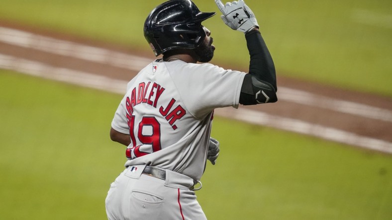 Sep 25, 2020; Cumberland, Georgia, USA; Boston Red Sox center fielder Jackie Bradley Jr. (19) reacts after hitting a home run against the Atlanta Braves during the fifth inning at Truist Park. Mandatory Credit: Dale Zanine-USA TODAY Sports