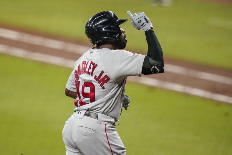 Sep 25, 2020; Cumberland, Georgia, USA; Boston Red Sox center fielder Jackie Bradley Jr. (19) reacts after hitting a home run against the Atlanta Braves during the fifth inning at Truist Park. Mandatory Credit: Dale Zanine-USA TODAY Sports