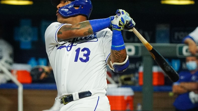 Sep 24, 2020; Kansas City, Missouri, USA; Kansas City Royals catcher Salvador Perez (13) hits a home run against the Detroit Tigers at Kauffman Stadium. Mandatory Credit: Jay Biggerstaff-USA TODAY Sports