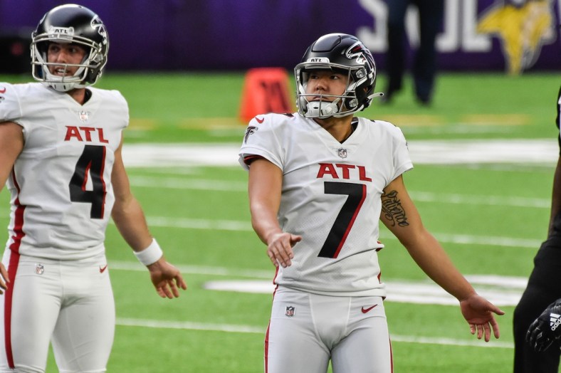 Oct 18, 2020; Minneapolis, Minnesota, USA; Atlanta Falcons kicker Younghoe Koo (7) and punter Sterling Hofrichter (4) in action during the game between the Minnesota Vikings and the Atlanta Falcons at U.S. Bank Stadium. Mandatory Credit: Jeffrey Becker-USA TODAY Sports