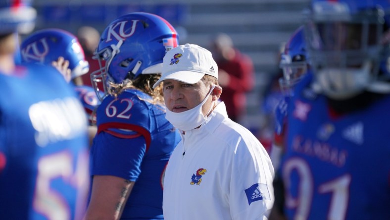 Oct 31, 2020; Lawrence, Kansas, USA; Kansas Jayhawks head coach Les Miles watches team warm ups before the game against the Iowa State Cyclones at David Booth Kansas Memorial Stadium. Mandatory Credit: Denny Medley-USA TODAY Sports