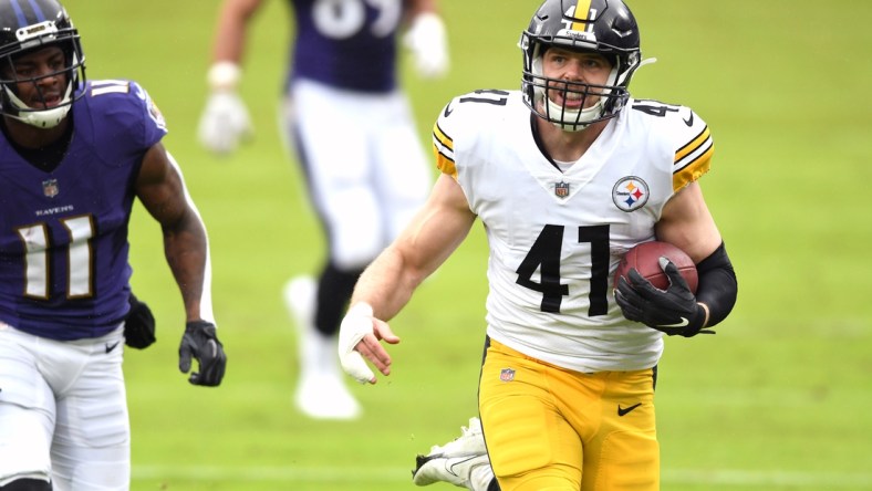 Nov 1, 2020; Baltimore, Maryland, USA;  Robert Spillane of the Pittsburgh Steelers returns an interception for a touchdown against the Baltimore Ravens in the first quarter at M&T Bank Stadium. Mandatory Credit: Mitchell Layton-USA TODAY Sports