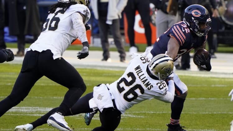 Nov 1, 2020; Chicago, Illinois, USA; Chicago Bears running back David Montgomery (32) breaks the tackle of New Orleans Saints cornerback P.J. Williams (26) during the first quarter at Soldier Field. Mandatory Credit: Mike Dinovo-USA TODAY Sports