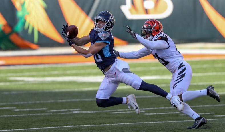 Nov 1, 2020; Cincinnati, Ohio, USA; Tennessee Titans wide receiver Adam Humphries (10) attempts to catch a pass against the Cincinnati Bengals in the first half at Paul Brown Stadium. Mandatory Credit: Katie Stratman-USA TODAY Sports