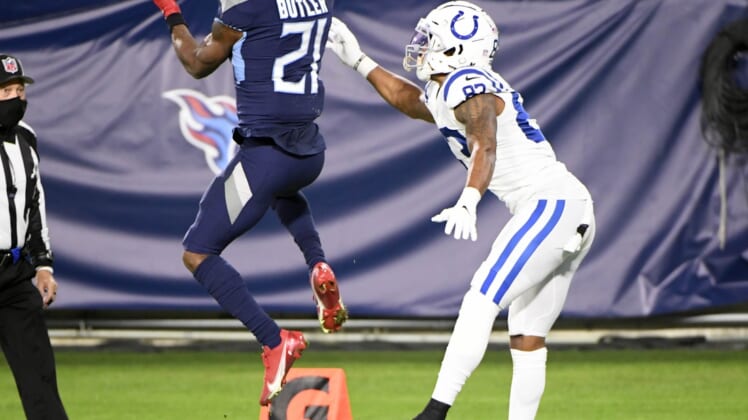 Nov 12, 2020; Nashville, Tennessee, USA; Tennessee Titans cornerback Malcolm Butler (21) makes the interception in front of Indianapolis Colts wide receiver Marcus Johnson (83) but ruled out of bounds during the second half at Nissan Stadium. Mandatory Credit: Steve Roberts-USA TODAY Sports