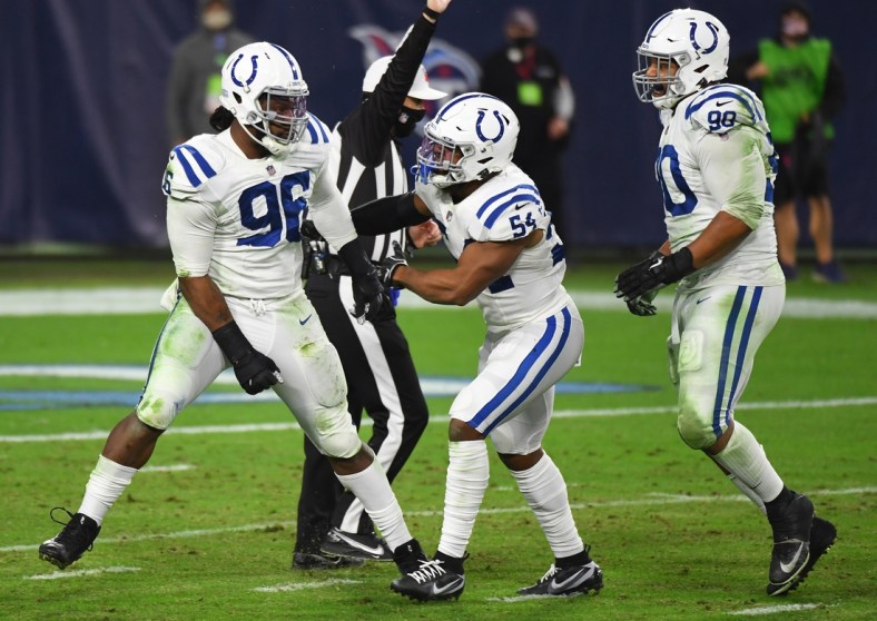 Nov 12, 2020; Nashville, Tennessee, USA; Indianapolis Colts defensive tackle Denico Autry (96) celebrates a sack with Indianapolis Colts middle linebacker Anthony Walker (54) and Indianapolis Colts defensive tackle Grover Stewart (90) during the second half against the Tennessee Titans at Nissan Stadium. Mandatory Credit: Christopher Hanewinckel-USA TODAY Sports