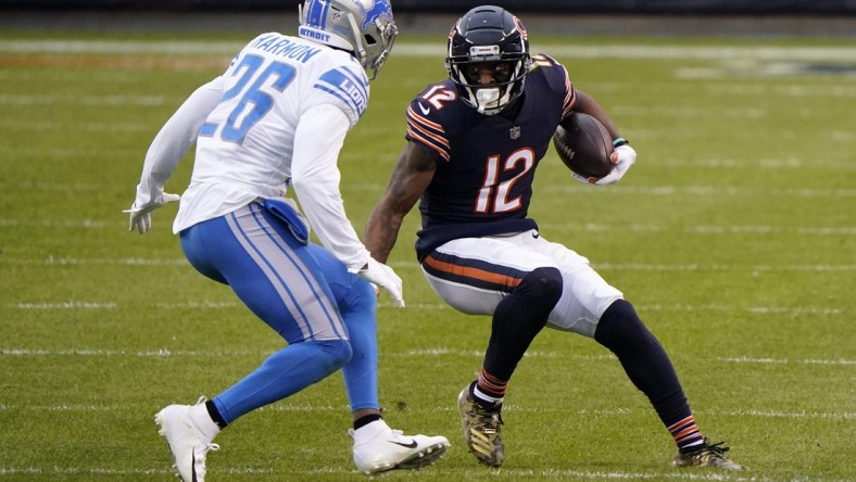 Dec 6, 2020; Chicago, Illinois, USA; Chicago Bears wide receiver Allen Robinson (12) makes a catch against Detroit Lions strong safety Duron Harmon (26) during the second quarter at Soldier Field. Mandatory Credit: Mike Dinovo-USA TODAY Sports