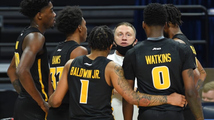 Dec 2, 2020; University Park, Pennsylvania, USA; Virginia Commonwealth Rams head coach Mike Rhoades talks with his team during a time-out in the second half against the Penn State Nittany Lions at the Bryce Jordan Center. Mandatory Credit: Rich Barnes-USA TODAY Sports