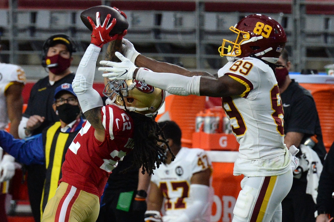 Dec 13, 2020; Glendale, Arizona, USA; San Francisco 49ers cornerback Jason Verrett (22) intercepts a pass intended for Washington Football Team wide receiver Cam Sims (89) during the first half at State Farm Stadium. Mandatory Credit: Joe Camporeale-USA TODAY Sports