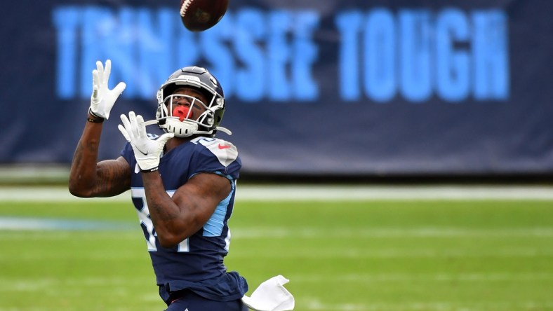 Dec 20, 2020; Nashville, Tennessee, USA; Tennessee Titans wide receiver Corey Davis (84) catches a 75-yard touchdown pass against the Detroit Lions during the first half at Nissan Stadium. Mandatory Credit: Christopher Hanewinckel-USA TODAY Sports