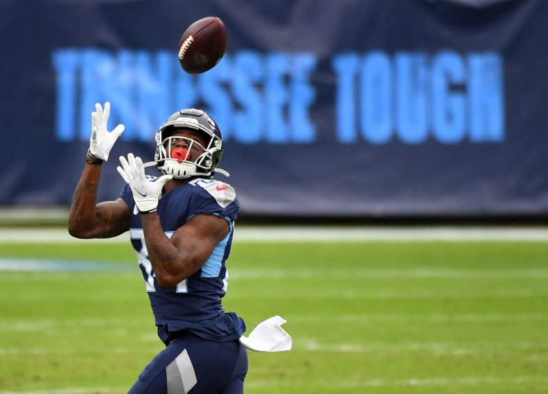 Dec 20, 2020; Nashville, Tennessee, USA; Tennessee Titans wide receiver Corey Davis (84) catches a 75-yard touchdown pass against the Detroit Lions during the first half at Nissan Stadium. Mandatory Credit: Christopher Hanewinckel-USA TODAY Sports