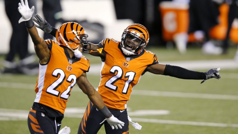 Dec 21, 2020; Cincinnati, Ohio, USA; Cincinnati Bengals cornerback Mackensie Alexander (21) and cornerback William Jackson (22) celebrate as the time winds down on the upset win over Pittsburgh Steelers at Paul Brown Stadium. Mandatory Credit: Joseph Maiorana-USA TODAY Sports