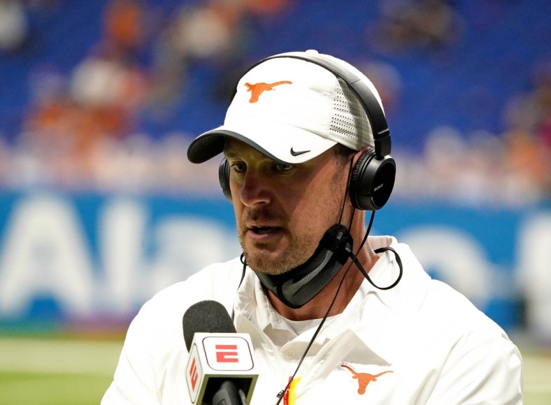 Dec 29, 2020; San Antonio, TX, USA; Texas Longhorns head coach Tom Herman is being interviewed during the first half against the Colorado Buffaloes at Alamodome. Mandatory Credit: Kirby Lee-USA TODAY Sports