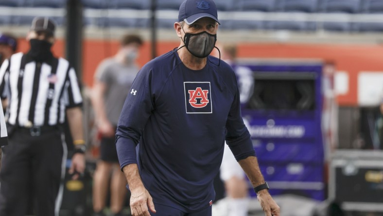 Jan 1, 2021; Orlando, FL, USA; Auburn Tigers interim head coach Kevin Steele walks on the field before the game against the Northwestern Wildcats at Camping World Stadium. Mandatory Credit: Reinhold Matay-USA TODAY Sports