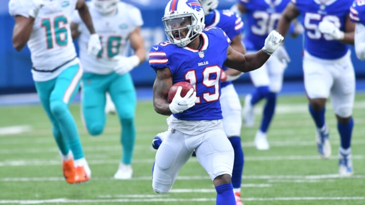 Jan 3, 2021; Orchard Park, New York, USA; Buffalo Bills wide receiver Isaiah McKenzie (19) returns a punt for a touchdown against the Miami Dolphins in the second quarter at Bills Stadium. Mandatory Credit: Mark Konezny-USA TODAY Sports