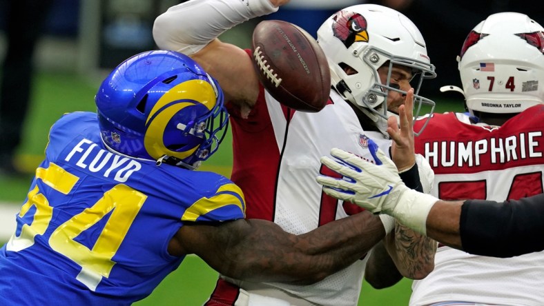 Jan 3, 2021; Inglewood, California, USA; Los Angeles Rams outside linebacker Leonard Floyd (54) applies pressure to Arizona Cardinals quarterback Chris Streveler (15) during the first half at SoFi Stadium. Mandatory Credit: Kirby Lee-USA TODAY Sports