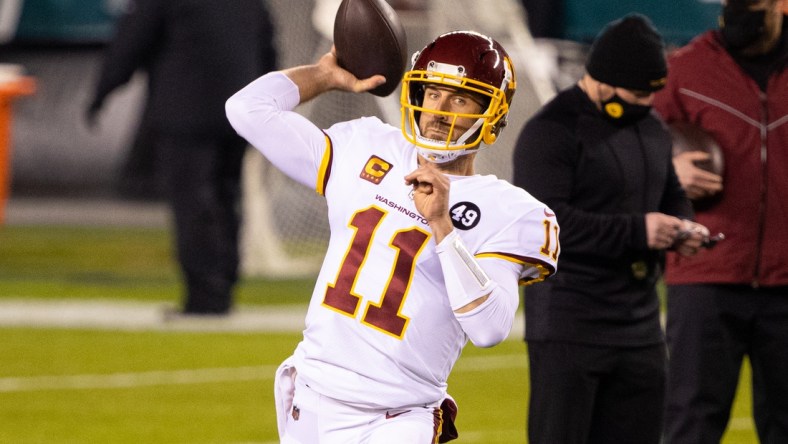 Jan 3, 2021; Philadelphia, Pennsylvania, USA; Washington Football Team quarterback Alex Smith (11) warms up before a game against the Philadelphia Eagles at Lincoln Financial Field. Mandatory Credit: Bill Streicher-USA TODAY Sports