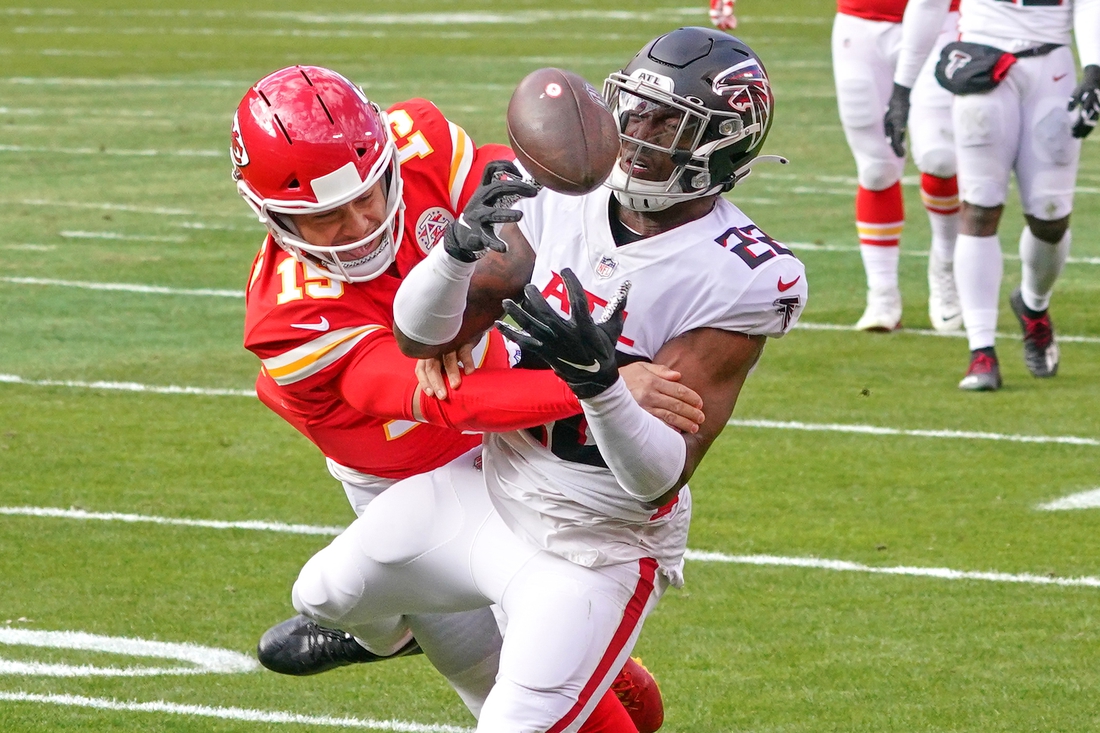 Dec 27, 2020; Kansas City, Missouri, USA; Atlanta Falcons strong safety Keanu Neal (22) intercepts a pass intended for Kansas City Chiefs quarterback Patrick Mahomes (15) during the game at Arrowhead Stadium. Mandatory Credit: Denny Medley-USA TODAY Sports