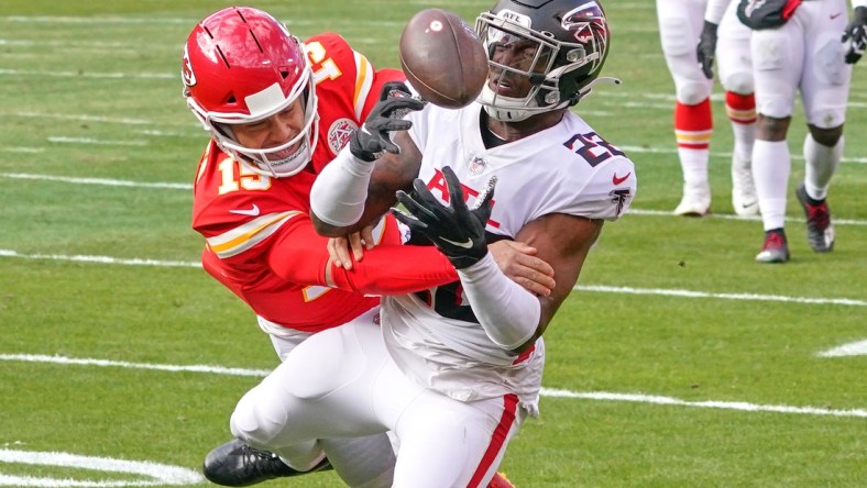 Dec 27, 2020; Kansas City, Missouri, USA; Atlanta Falcons strong safety Keanu Neal (22) intercepts a pass intended for Kansas City Chiefs quarterback Patrick Mahomes (15) during the game at Arrowhead Stadium. Mandatory Credit: Denny Medley-USA TODAY Sports