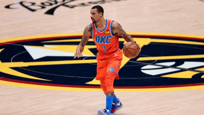 Jan 19, 2021; Denver, Colorado, USA; Oklahoma City Thunder guard George Hill (3) dribbles the ball up court against the Denver Nuggets in the third quarter at Ball Arena. Mandatory Credit: Isaiah J. Downing-USA TODAY Sports