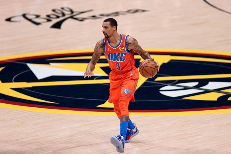 Jan 19, 2021; Denver, Colorado, USA; Oklahoma City Thunder guard George Hill (3) dribbles the ball up court against the Denver Nuggets in the third quarter at Ball Arena. Mandatory Credit: Isaiah J. Downing-USA TODAY Sports