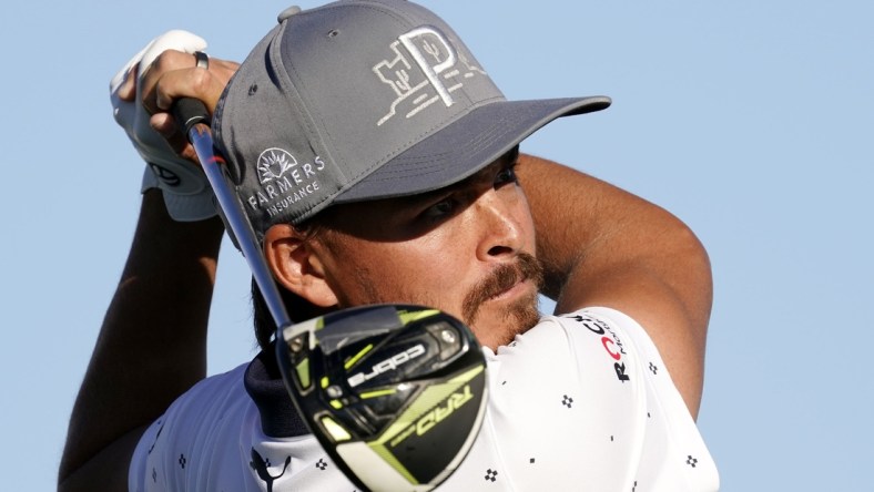 Feb 4, 2021; Scottsdale, Arizona, USA; Rickie Fowler plays his tee shot on the 15th hole during round one of the Waste Management Phoenix Open at TPC Scottsdale. Mandatory Credit: Rob Schumacher-USA TODAY NETWORK