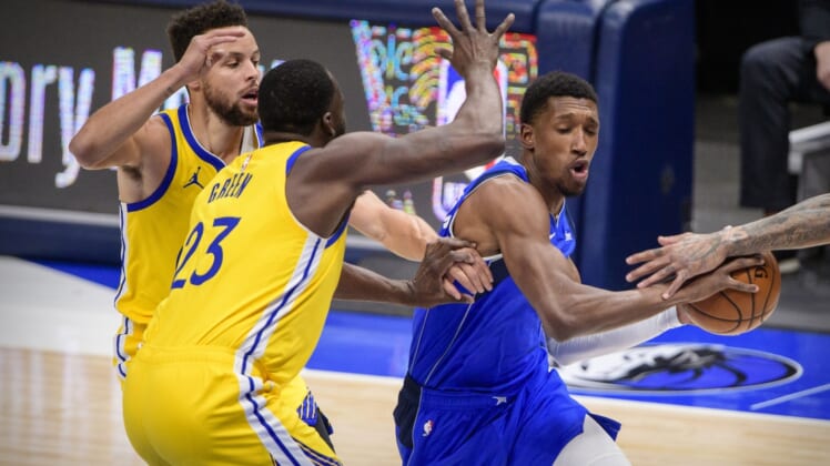 Feb 4, 2021; Dallas, Texas, USA; Dallas Mavericks guard Josh Richardson (0) drives to the basket past Golden State Warriors guard Stephen Curry (30) and forward Draymond Green (23) during the first quarter at the American Airlines Center. Mandatory Credit: Jerome Miron-USA TODAY Sports